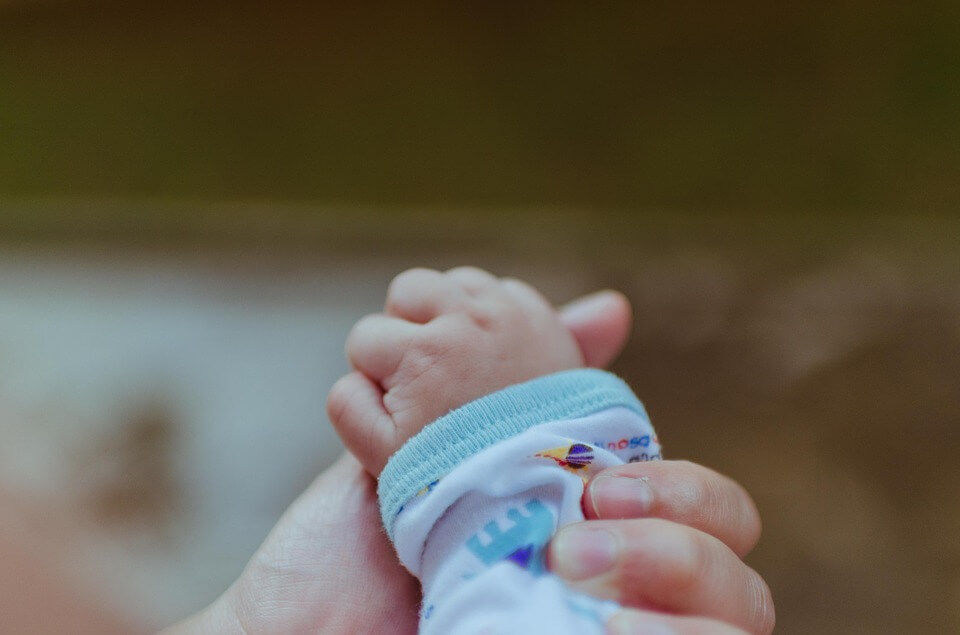 Baby holding hand
